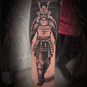 Black and grey scizzors over flower tattoo