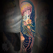 Black and grey scizzors over flower tattoo