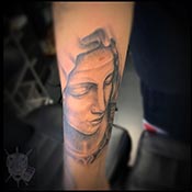 saint tattoo in black and grey